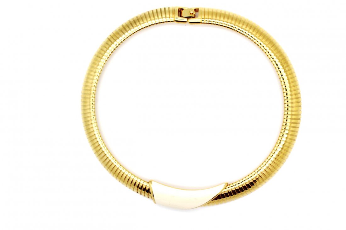 20: Vintage Gold Monet Omega Necklace: Thick gold vintage omega style Monet necklace with off white center piece Measures 16" in diameter & 1/2" in wide Stamped Monet on clasp Good vintage condition
