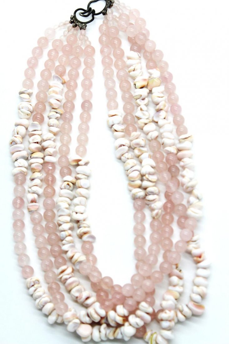 240: Vintage Pink Multi Strand Bead & Seashell Necklace: Five strands of pink bead & seashell necklace. Measures 21" in length