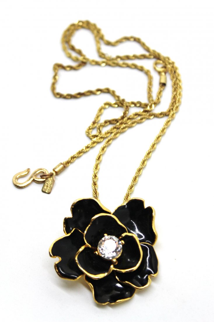 Kenneth Jay Lane Gold Tone Enamel Flower Necklace: 18" in length. Rope necklace with large enamel flower pendant with rhinestone center. Signed Kenneth Lane