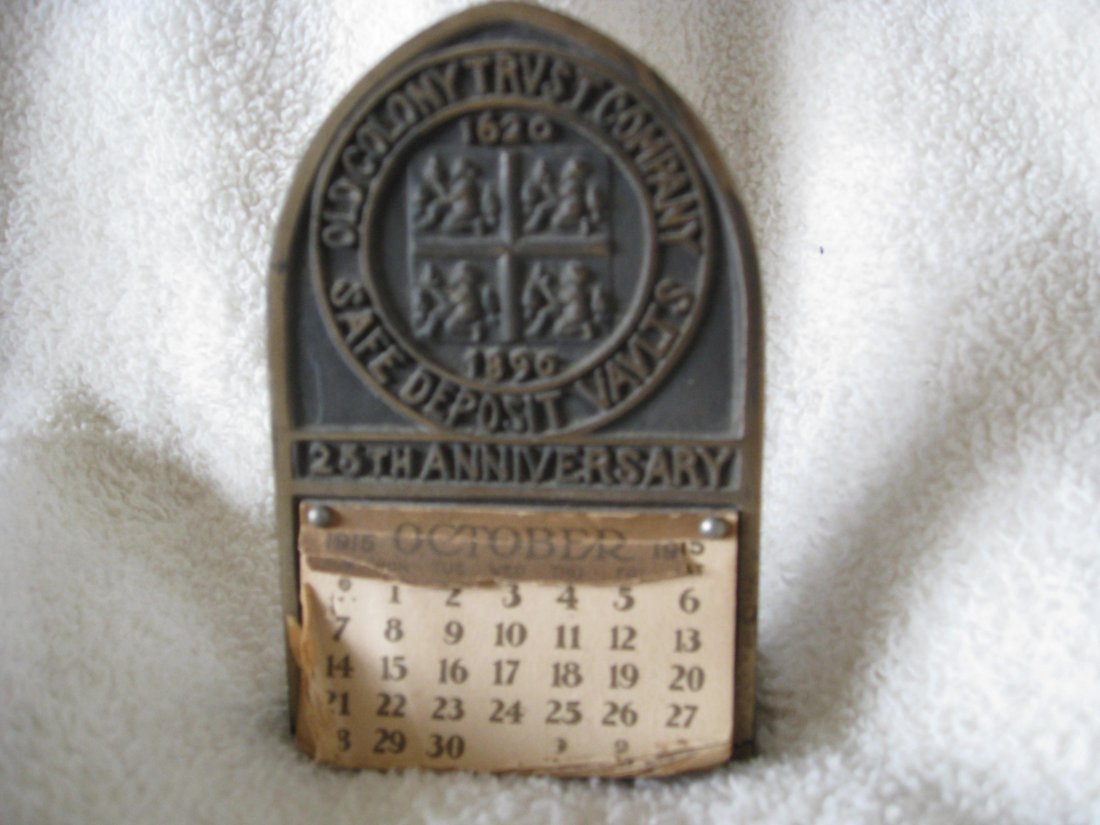 ANTIQUE OLD COLONY TRUST COMPANY SAFE DEPOSIT VAULTS 25: Calendar holder. 4.75 inches tall and 3 inches wide. The base is 3 inches wide and 1.75 inches deep. October showing, under that there is Nov. and Dec. of 1915 then full 1916 calendar. It reads Old Co