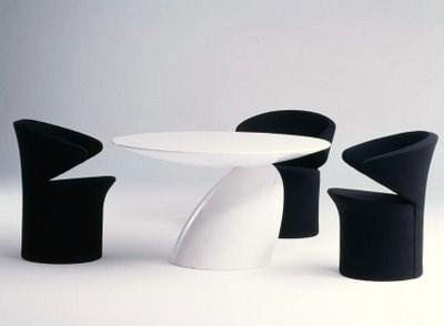 Modern Fiberglass Dining Room Table & Chair Set: Retails for $6000.00 at fine furniture stores. The complete set weighs 400 pounds each. Includes 4 chairs. Shipping amount per set is $299.00 anywhere in the United States. Specifications: Table Size: