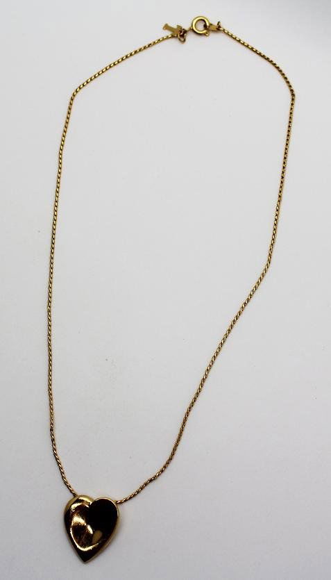 154: Vintage Gold Trifari Heart Charm Necklace: Marked Trifari on charm. 16" long.
