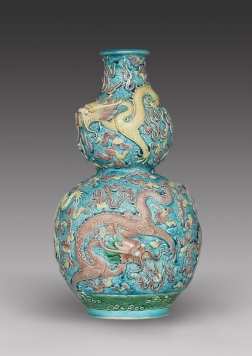Carved Dragons and Clouds Vase, Double-Gourd Shape: Carved dragons and clouds porcelain vase on a turquoise ground, double gourd shape, 20th century, QianLong mark on base, ht. 8 3/4 in. Pre 1930.