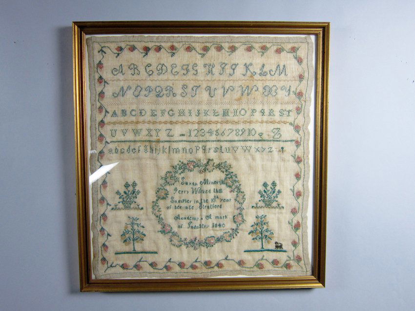 Needlework Sampler: "Sarah Minerv () Perry Worked this Sampler in the 10th year of her age. Stratford Academy * A mark of Industry 1840" Overall fading, some stains, edges uneven. Dimensions: 17 5/8" x 16"
