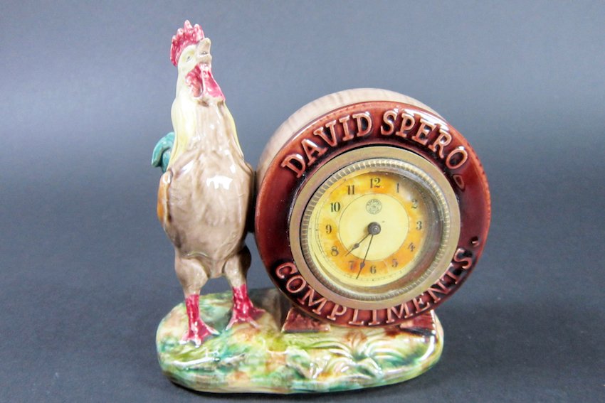 Rooster and Barrel Majolica Clock: Clock face has a New Haven trademark. Clock face has tear and discoloration. Dimensions: height - 5", width 4 7/8"