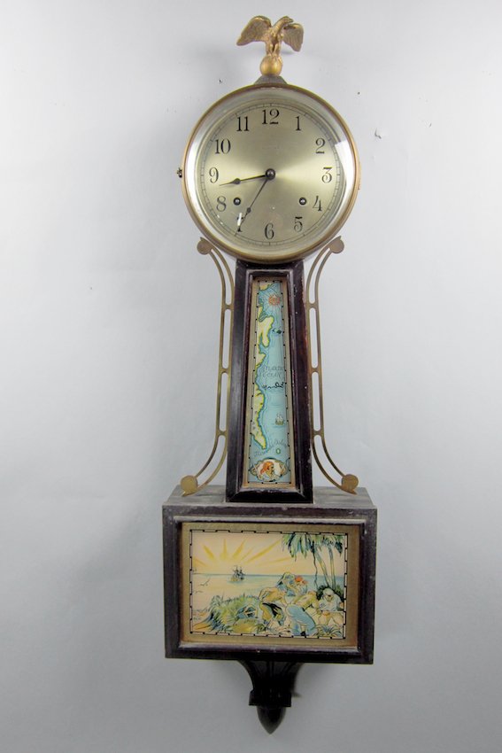 Ingraham Banjo Clock: With pirate motif and eagle finial. Length - 38 1/2"