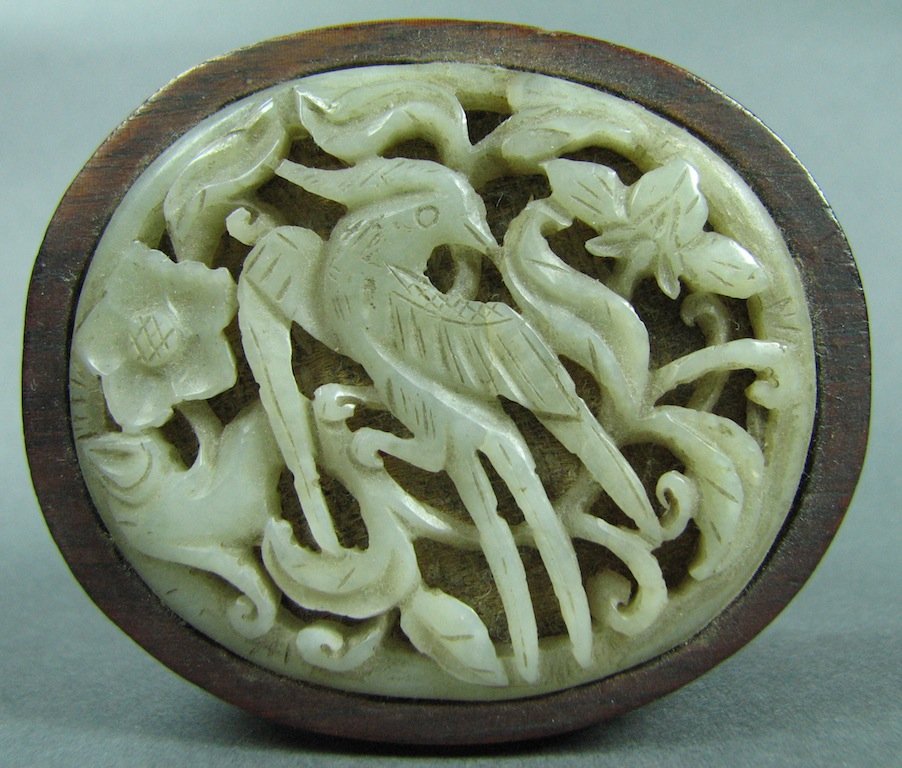 Oval Carved Wooden Box with White Jade Insert in Cover: Having reticulated bird and flowers. Dimensions: diameter - 2" x 2 3/4", height - 1 5/8"