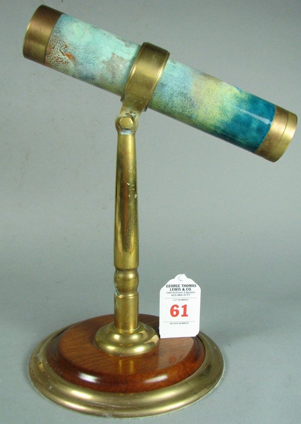 Handcrafted Brass Enamel-Decorated Kaleidoscope: Mounted on brass and wood pedestal base, signed Steven Auger, 1983. Height - 13", Length - 10", Diameter - 2"