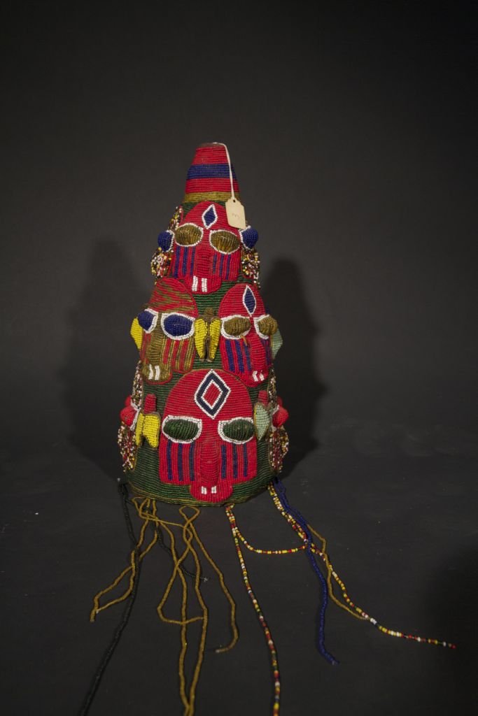 Yoruba Royal Beaded Crown: Yoruba Royal Beaded Crown Nigeria Beads and cloth 15” (height) Provenance: ex. Merton D. Simpson, New York This item is from the New York gallery collection of Merton D. Simpson, one of the world's