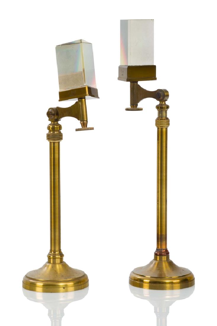 A PAIR OF PRISMS BY JULES DUBOSCQ À PARIS, CIRCA 1860: A PAIR OF PRISMS BY JULES DUBOSCQ À PARIS, CIRCA 1860 the 3in. prisms adjustable on two axes and mounted in lacquered brass stand and inscribed with maker's marks signed as per title and inscribed C.