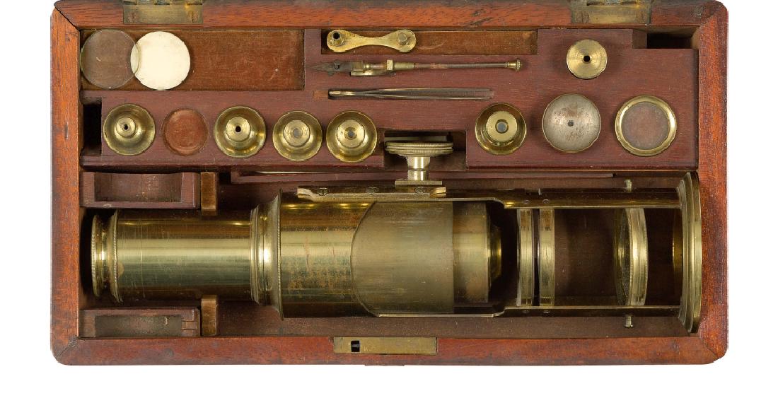 A 19TH CENTURY DRUM MICROSCOPE: A 19TH CENTURY DRUM MICROSCOPE unsigned , of typical form and constructed in lacquered brass contained in fitted wooden box with five (of six) nose pieces; lieberkhün reflector, live box, platform fo
