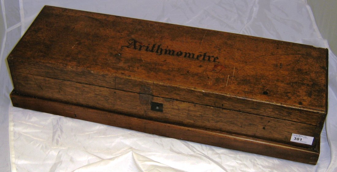 A 19TH-CENTURY ARITHMOMETRE signed and numbered on the : A 19TH-CENTURY ARITHMOMETRE signed and numbered on the brass bed plate by Thomas Gonnar Harris, numbered 2178, with retail label inside lid inscribed CH. & J. FAVER-BRANDT YOKOHAMA & OSAKA, contained 