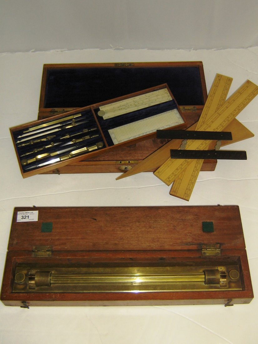Ø A LATE 19TH-CENTURY DRAWING SET unsigned, with plush-: Ø A LATE 19TH-CENTURY DRAWING SET unsigned, with plush-lined compartments containing brass and steel instruments, the pens with ivory handles, ivory sector and rule, the base containing boxwood rules