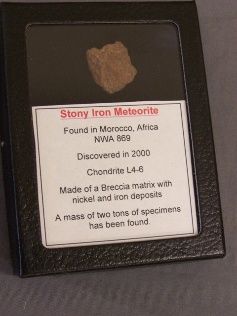 Stony Iron Meteorite in Presentation: Stony iron meteorite found in Morocco Africa in a 4 1/2 X 3 1/2 in presentation box