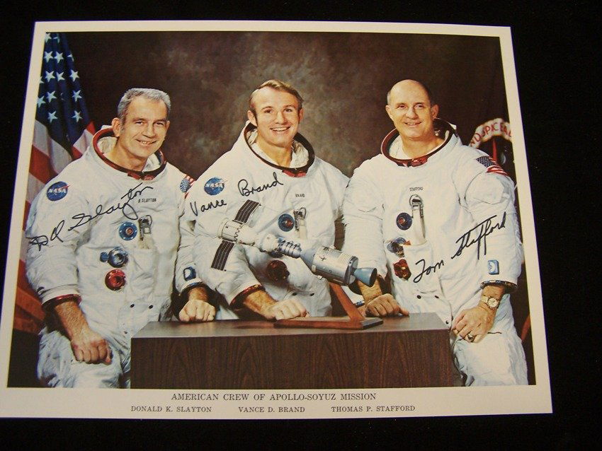 Apollo Soyuz American Crew Signed Litho: Believe to be autopen measures 8 X 10 in original period employee given item From the estate of a Joel H. Taft a 40 plus year veteran of Grumman Aerospace Corporation