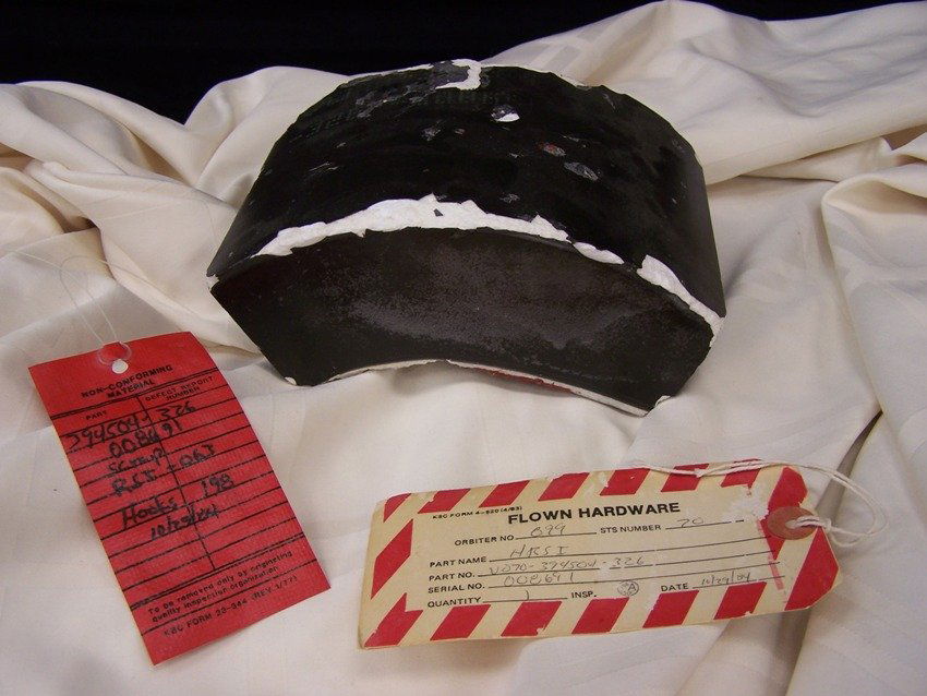 Rare Flown Challenger Space Shuttle Tile with Tags: Flown with proper tags Early Challenger 1984 Acquired from the Charles Bell Auction years ago Flown in Space and Scraped by NASA very rare find and measures 8 in long X 6 in wide X 2 3/4 in deep Absol