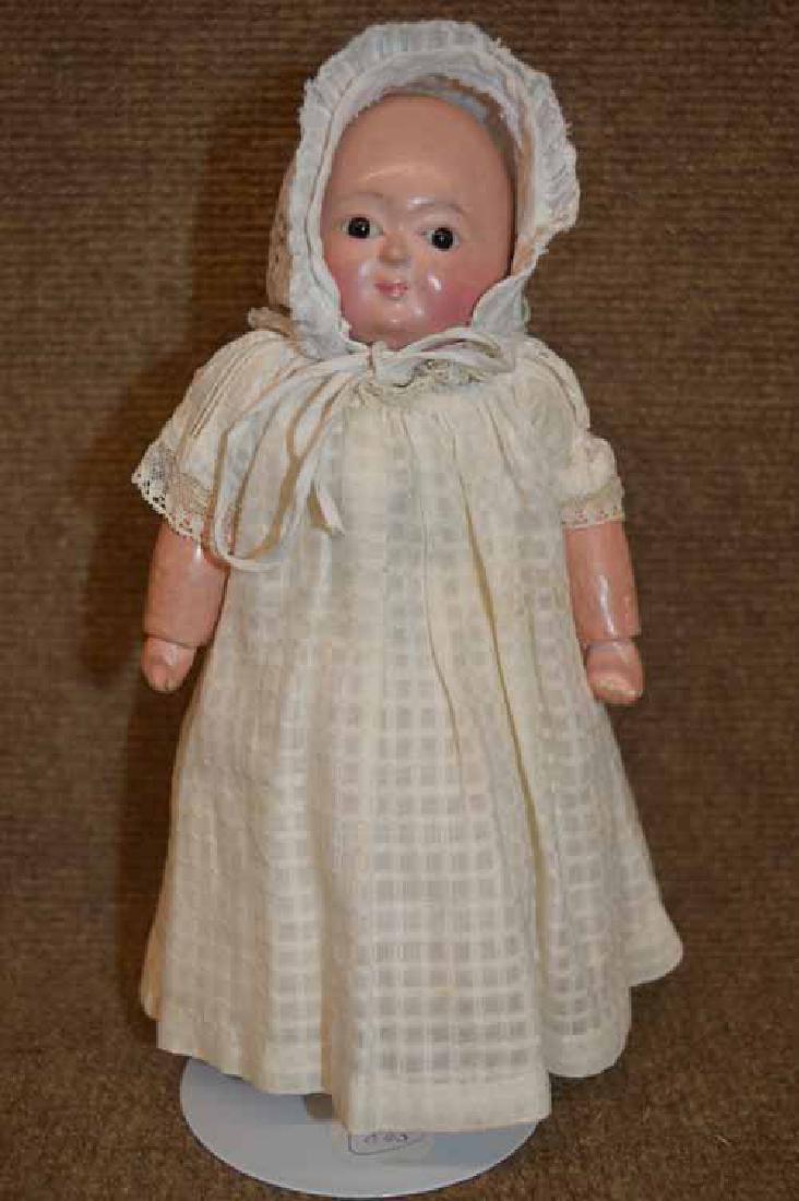 9" Papier-Mache & Cloth Motchman Baby: 9" Papier Mache & Cloth Motchman Baby w/floating hips, legs & arms, JTD at wrists, neck & ankles, faint brush stroke hair at sides & back, pupiless set back eyes, cotton windowpane dress & later white
