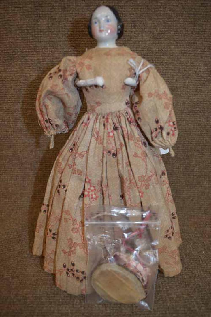 12" Pink Tint China Shoulder head: 12" Pink Tint China Shoulder head, cloth body, blue eyes, sewn on black leather boots, replaced leather mitt hands, brown print cotton dress, remnants of hat & ribbon in separate bag