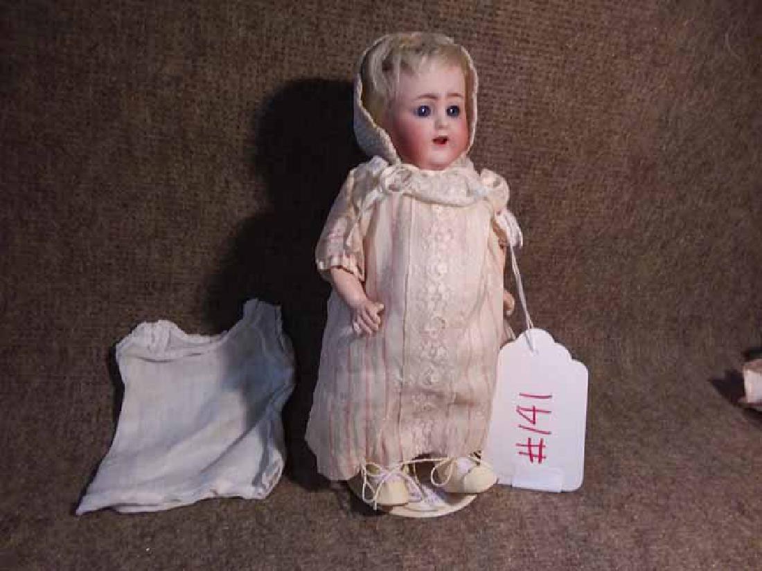 Bisque Head Doll: 8 1/4" MOLD 1367 18 MADE IN GERMANY 2 BISQUE HEAD ON 5 PC TODDLER BODY, BLONDE MOHAIR WIG, FIXED BLUE EYES, O/M W/TWO TOP TEETH, WEARING A PINK STRIPE ON OFF-WHITE EMBOSSED SILK DRESS W/LACE ACCENTS, 
