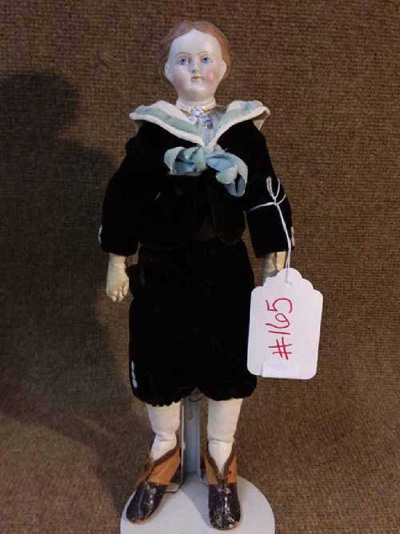 Cafe Au Lait Parian: 13" PARIAN CAFE AU LAIT HAIR, MOLDED BLOUSE, W/GOLD & BLUE ASCOT, DRESSED AS A BOY, BLUE EYES, EXPOSED EARS, CLOTH BODY W/LEATHER ARMS, WEARING HIS OLDER BROTHERS TWO-TONE EARLY LEATHER SHOES WHICH AR