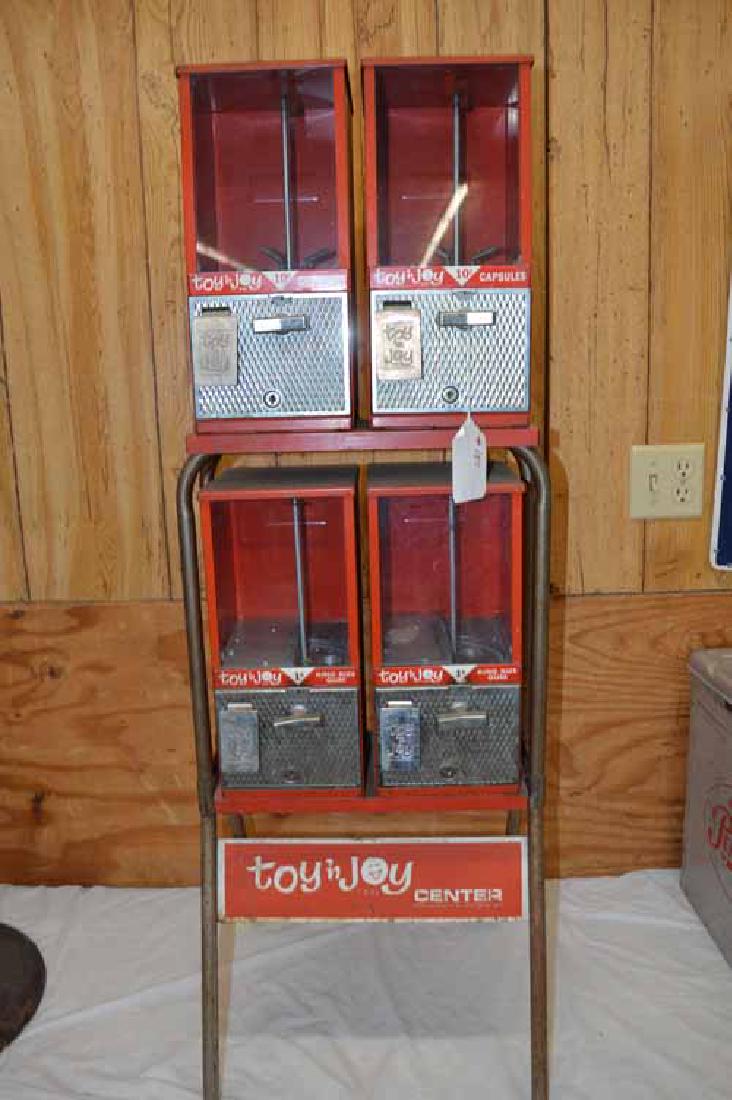 TOY & JOY DISPENSER RACK: STANDING TOY & JOY GUMBALL/TOY DISPENSER RACK W/4 UNITS- 1 CENT & 10 CENTS