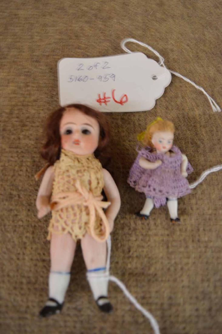 (2) ALL BISQUE DOLLS: (2) ALL BISQUE DOLLS TO INC: 4 1/2" STIFF NECKED JTD AT SHOULDERS & HIPS; BROWN MOHAIR WIG; BLUE STATIONARY EYES; O/M; OFF-WHITE CROCHETED ONESIE & MOLDED PTD WHITE SOCKS W/SINGLE STRAP MARY JANES AND