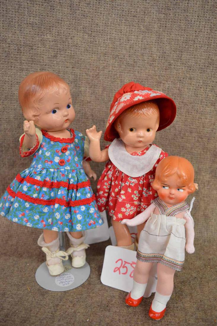 GRPING OF (3) COMPO DOLLS: GRPING OF (3) COMPO DOLLS TO INC: 9" EFFANBEE PATSYETTE WEARING RED PRINT SUNDRESS W/MATCHING HAT & OILCLOTH SHOES - 10" UNMARKED COMPO IN MULTI-COLORED CHERRY PRINT DRESS & OILCLOTH SHOES - 7 3/4" ST