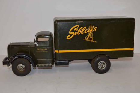 SMITH-MILLER MACK TRUCK LABELED "SIBLEY'S': SMITH-MILLER MACK TOY TRUCK LABELED "SIBLEY'S' ON SIDES, "SIBLEY, LINDSAY, & CURR CO. ROCHESTER, NY" ON BACK DOORS, DECALS IN GOOD SHAPE, SOME PAINT CHIPS, SCRATCHES, SPOTS OF SURFACE RUST, BROKEN BUM