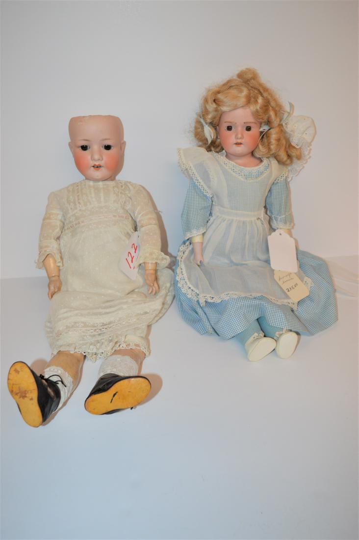 (2) ANTIQUE BISQUE DOLLS: (2) ANTIQUE BISQUE DOLLS TO INCLUDE A 20" AM SHOULDERHEAD ON KID JTD BODY, REPLACED BLONDE WIG, FIXED BROWN EYES, FUR EYEBROWS, O/M W/4 TEETH, WEARING A BLUE CHECKED DRESS W/WHITE APRON, ANTIQUE WHITE