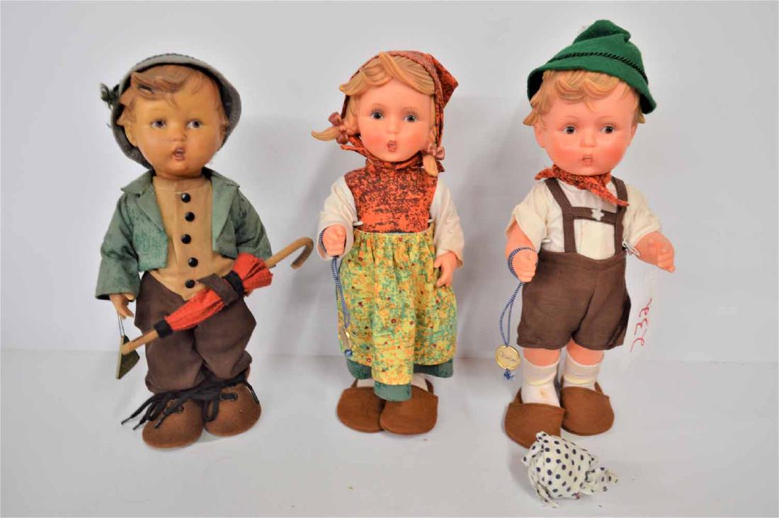 HUMMEL BOY/GOEBEL PAIR OF DOLLS: (3) DOLLS TO INC: MJ HUMMEL ORIGINAL BOY IN ORIG. OUTFIT, HAND TAG,-- PAIR OF GOEBEL GIRL & BOY IN ORIG OUTFITS, BOTH HAVE HAND TAGS, ALL ARE 12" TALL