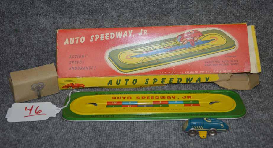 SPEEDWAY JR. RACE TRACK: TIN KEY WIND AUTO SPEEDWAY JR SMALL RACE TRACK W/ (1) CAR AND ORIGINAL BOX, HAS KEY