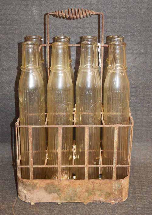 TIOLENE OIL BOTTLES IN RACK (1 of 3)