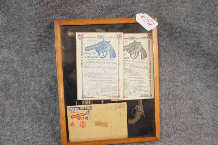 DISPLAY W/CAP GUNS: NICE DISPLAY OF CHILDREN'S CAP GUNS IN A OAK DISPLAY CASE, W/HUBLEY & STEVENS CAP GUN LITERATURE, ALSO WILFONG FIREWORKS BROCHURE FEATURING DIFFERENT CAP GUNS