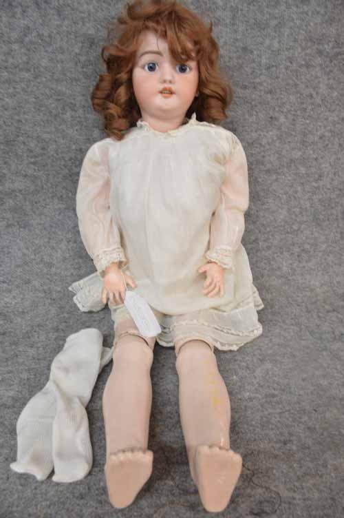 34" S & H 1079: 34" S & H 1079 BISQUE ON BJTD COMPO BODY, SET BLUE EYES, O/M, PIERCED EARS, CRACK ACROSS BACK OF HEAD FROM EAR TO EAR, NICELY DRESSED IN WHITE DRESS W/UNDIES, REPLACED SOCKS & SYNTHETIC BROWN WIG, REP