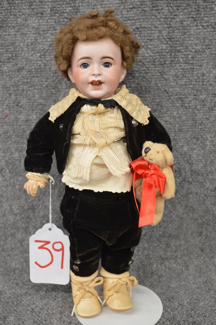 12 3/4" SFBJ 236 PARIS "LAUGHING JUMEAU": 12 3/4" SFBJ 236 PARIS "LAUGHING JUMEAU", O/C BLUE EYES, O/M LAUGHING MOUTH W/MOLDED TONGUE & (2) UPPER TEETH, BROWN CARICUL WIG, NICELY REDRESSED IN BLACK VELVET SUIT W/LACE SHIRT, CARRYING MODERN BE