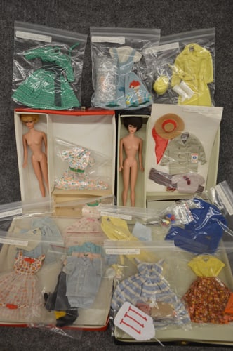 1960'S BARBIE DOLL CASES & CLOTHING: (2) BARBIE DOLL CASES TO INC: 1961 PONY TAIL CASE & 1963 PONY TAIL W/BUBBLE CUT IMAGE. BOTH CASES HAVE NUDE BUBBLE CUT BARBIES & TAGGED & UNTAGGED CLOTHING & SOME SHOES & ACCESSORIES