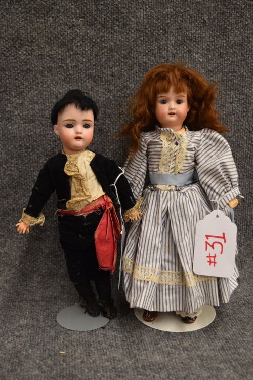 13" FLORADORA MARKED A 5/0 M & 12" MOLD MARK 457 2/0: (2) DOLLS TO INC: 13" FLORADORA MARKED A 5/0 M, FIXED GREY EYES, O/M W/4 TEETH, JTD BODY, AND 12" MOLD MARK 457 2/0, O/EYES, O/MO W/4 TEETH, PIERCED EARS, SHORT BLACK WIG, IN BLACK VELVET OUTFIT AND R