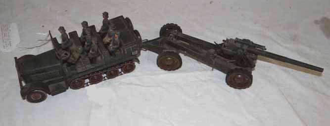 German Half Track: Tin Wind Up German Half Track #WL217 with tin artillary Cannon in tow with 8 composition soldiers-half track is 9"L x 3 1/4"H x 3 1/2"W cannon is 13"L x 3 1/4"H