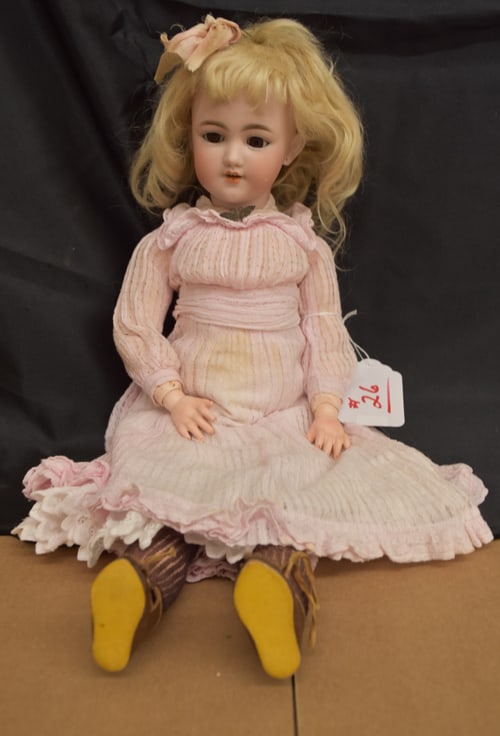 SIMON & HALBIG DOLL: 21" BLONDE BISQUE SIMON & HALBIG GERMANY 9 W/BROWN SLEEP EYES, O/M WITH 4 TEETH & PIERCED EARS, REPLACED COMPO BODY, WOOD & COMPO LEGS, WEARING PINK VINTAGE DRESS W/UNDER SKIRT, PANTALOONS, ANTIQUE SO