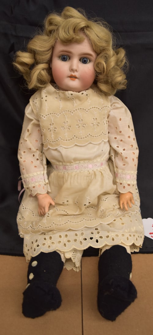 A & W "SPECIAL" DOLL: A & W "SPECIAL" BLONDE BISQUE SOCKET HEAD ON COMPOSITION BALL JTD BODY. REPLACED BLONDE WIG, BLUE/GREY SLEEP EYES, O/MOUTH W/4 TEETH, REPLACED WHITE EYELET DRESS W/BLUE RIBBON, HAS ORIGINAL PANTALOONS