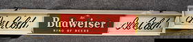 PLASTIC BUDWEISER LIGHT UP SIGN: METAL AND PLASTIC BUDWEISER LIGHT UP SIGN - DOES NOT WORK - "ICE COLD" - MEASURES 48 1/8" L X 5 3/8" H X 5" D