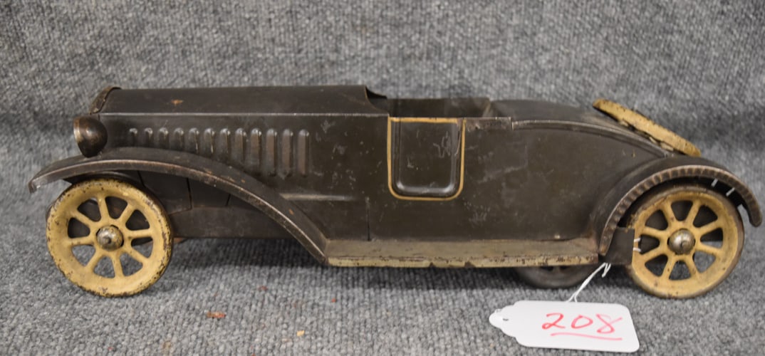 PRESSED STEEL ANTIQUE FRICTION TOY CAR: PRESSED STEEL ANTIQUE FRICTION TOY CAR- 17 1.2" L X 5" H X 5 1/2" W/ORIGINAL PAINT
