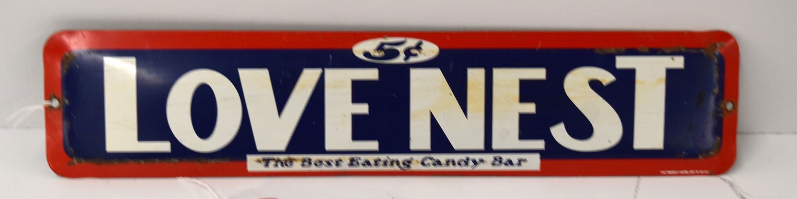 LOVE NEST CANDY SIGN: LOVE NEST CANDY BAR TIN ADVERTISING SIGN BY THE PARKER METAL DEC CO