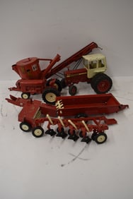 GROUP OF (7) INTERNATIONAL TOYS (TRACTORS & IMPLEMENTS)