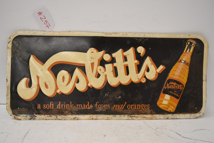 NESBITT'S SOFT DRINK SIGN: "NESBITT'S SOFT DRINK MADE FROM REAL ORANGES" SINGLE SIDED METAL EMBOSSED SIGN, BY WIEGAND MFG CO