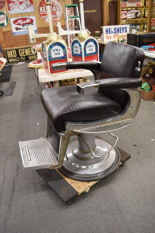 BELMONT BARBER'S CHAIR: VINTAGE BELMONT BARBER CHAIR WITH FAUX ALLIGATOR SKIN UPHOLST. HAS ASH TRAY IN ARM,