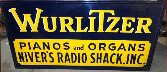 Wurlitzer Piano Advert. Sign: Tin Single Sided Wurlitzer Pianos & Organs Advert. Sign- 72"W x 36"H- On Wooden Frame