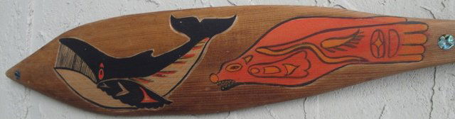 Northwest Coast Dance Paddle: Northwest Coast Dance Paddle; sea lion playing with killer whale, abalone,red cedar & acrylic paint; 58 inch long; carved on both sides by first nation artist Jake Gallic msrp 1800
