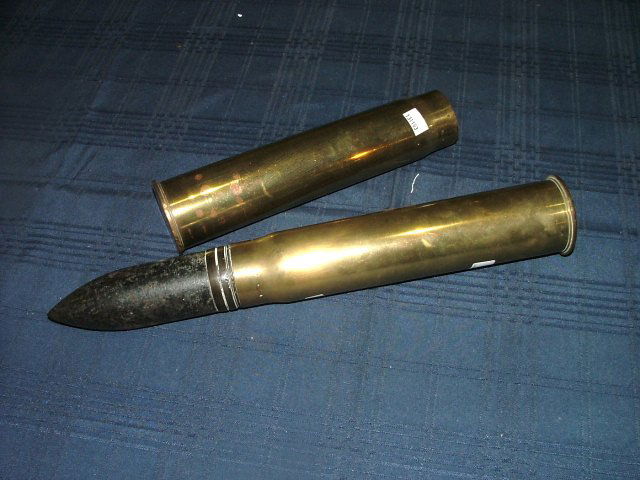 Shell Cases.Start Bid €20.: Two artillery shell cases.
