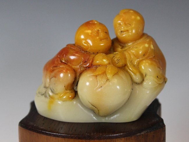 A "CHILD" SOAPSTONE DECORATION: H2in